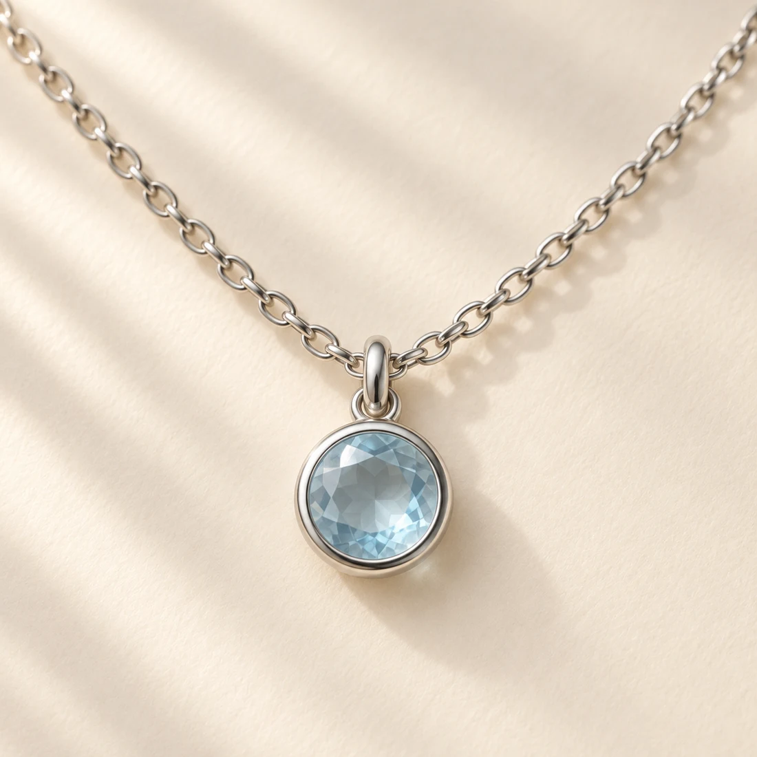Sora Blue Necklace: close-up of the Silver / Pale Blue pendant