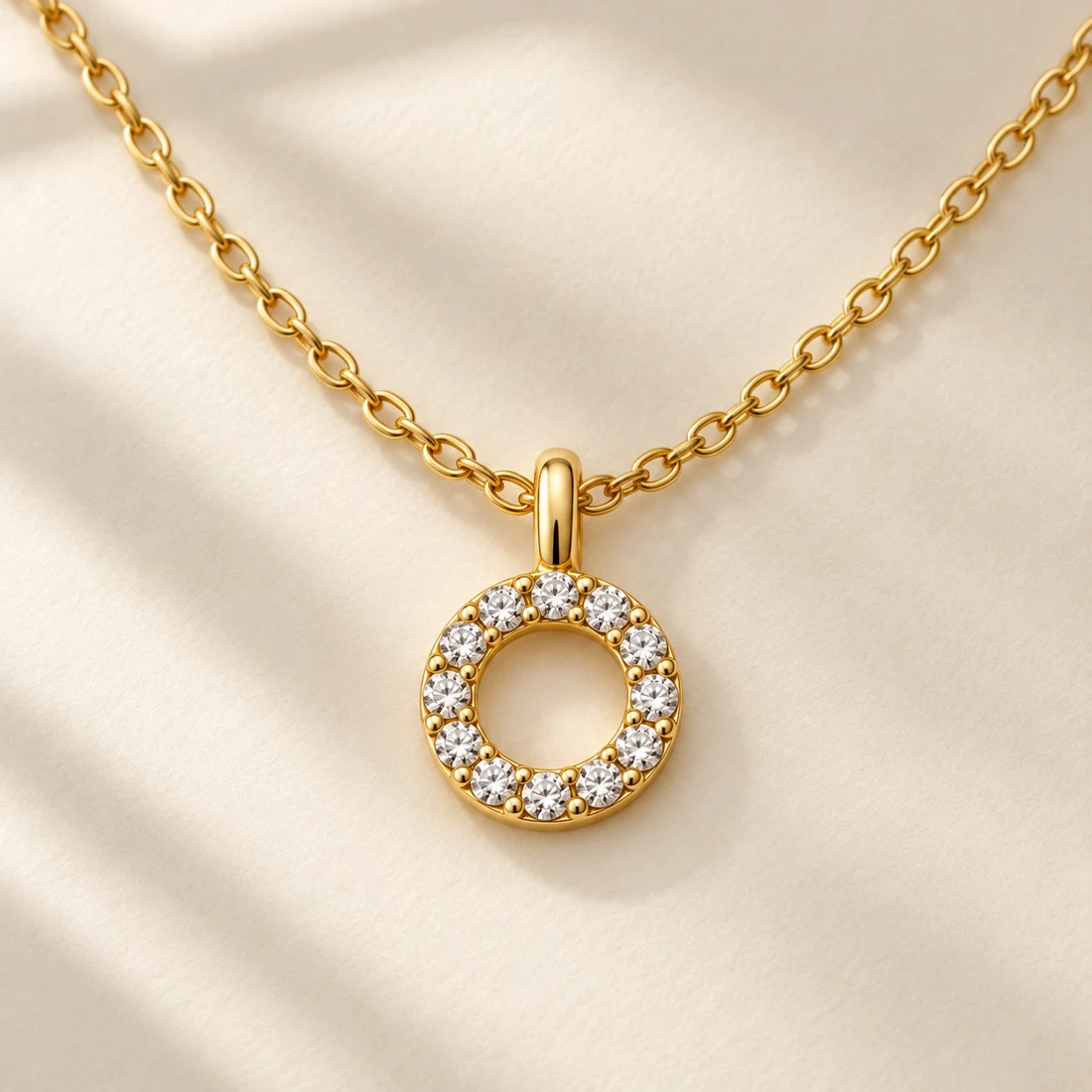 Akari Halo Necklace: close-up of the Gold / Clear pendant