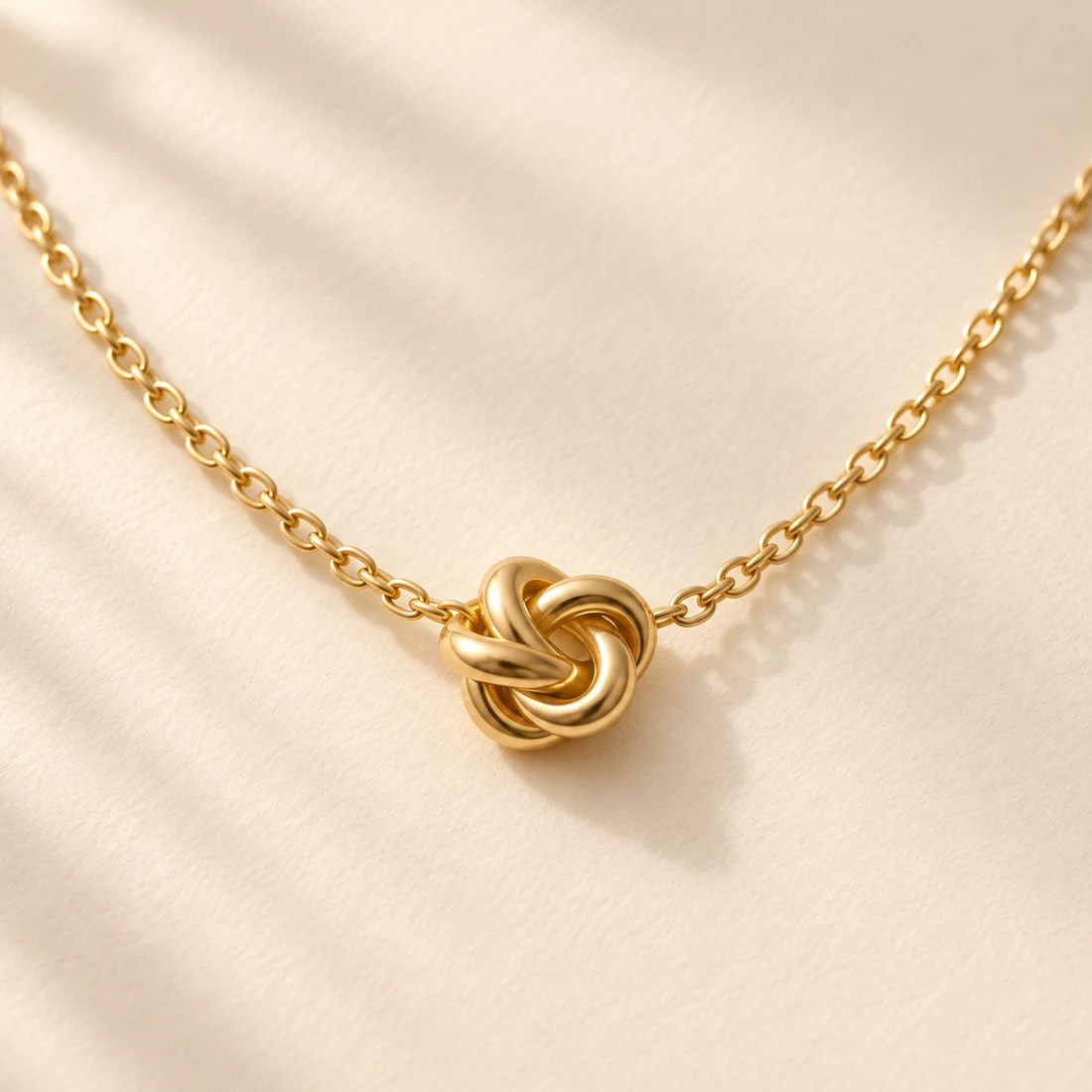 Ito Knot Necklace: close-up of the Gold pendant